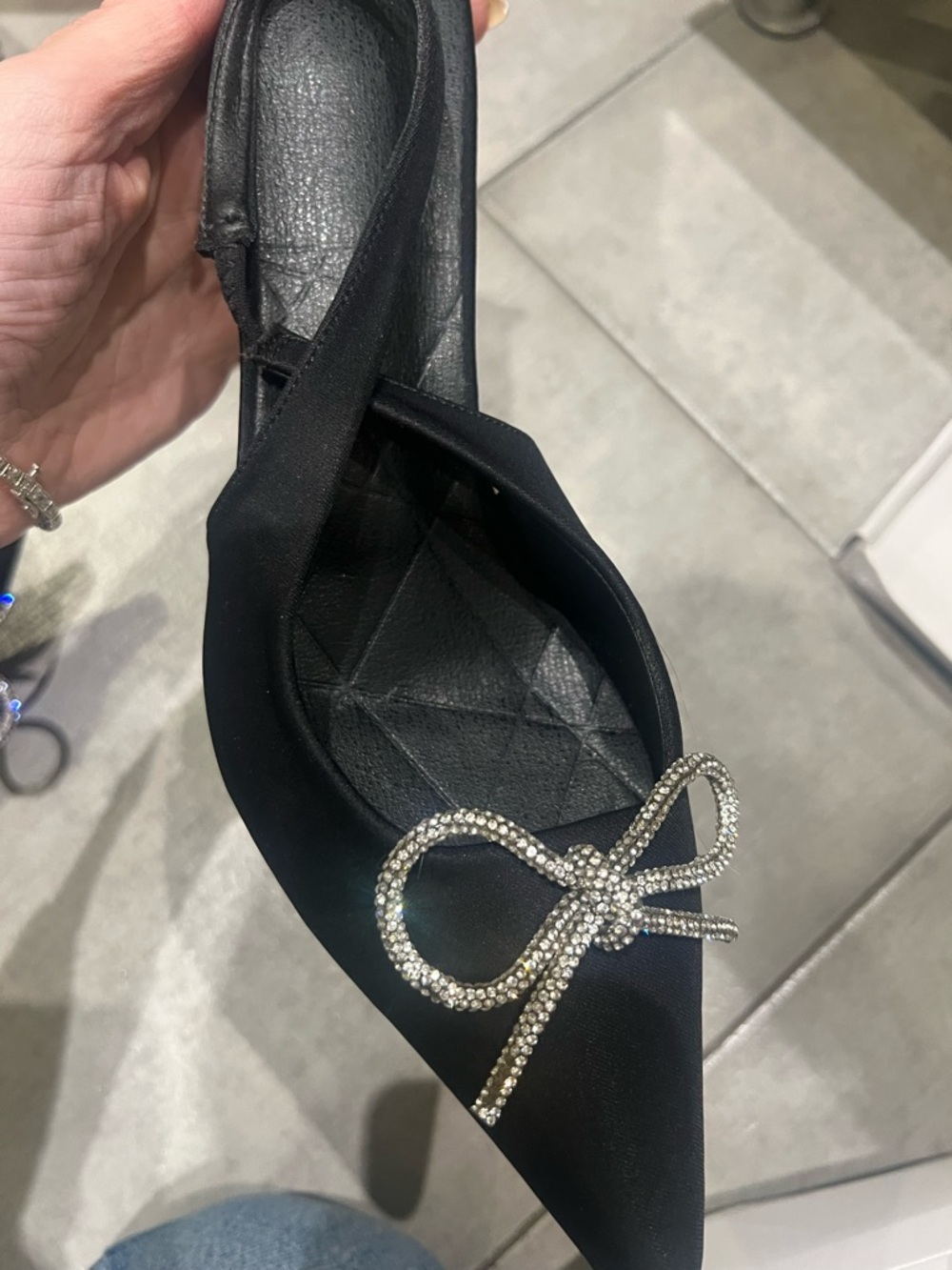 Black satin pumps